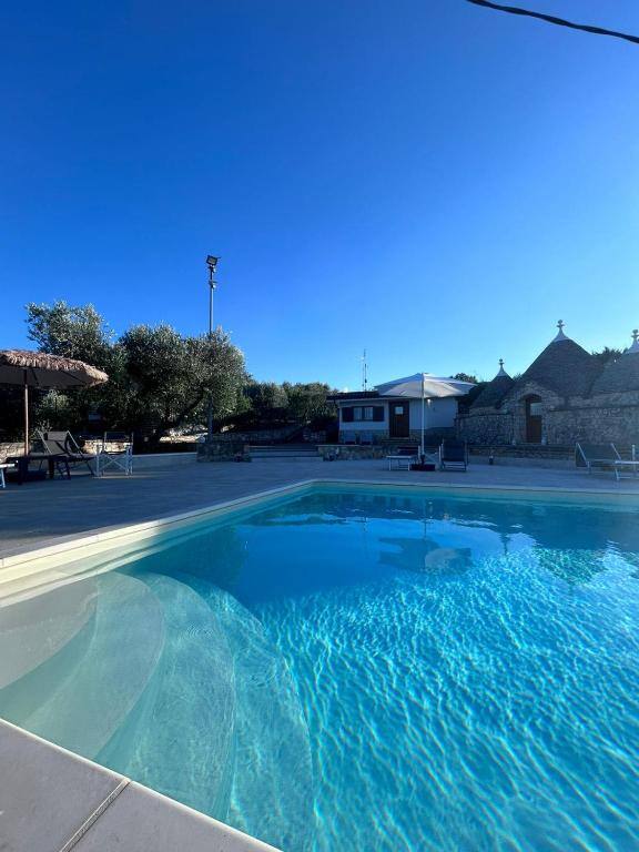 Outdoor swimming pool at I Trulli di Eva